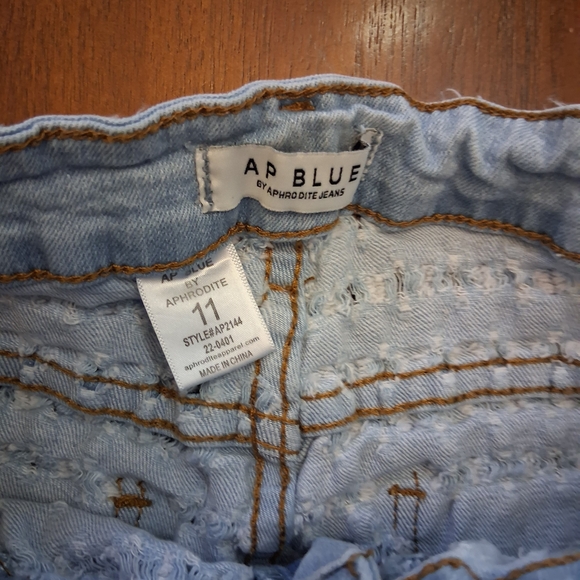 Aphrodite Sky Blue Ripped JeansThis is a pair of Venus Laser Etched Denim Shorts - Picture 6 of 6